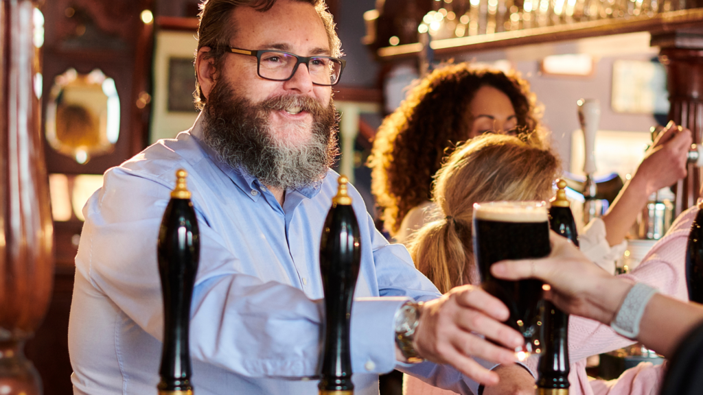 pub owner serving a pint