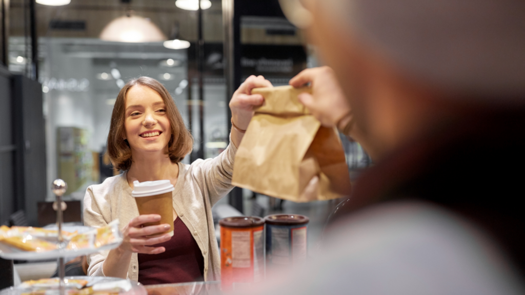 Woman handing over takeaway